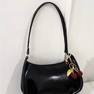 Elegant Black Shoulder Bag with Cherry Charm